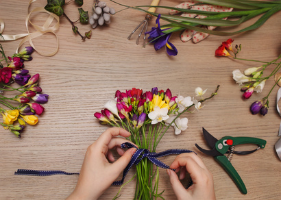 Florist at work. Woman making bouquet